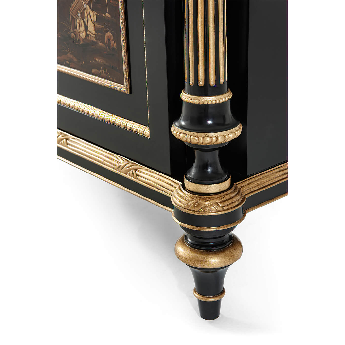 Detailed view of cabinet leg with gold accents.