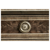 Console table drawer knob, detailed circular design.