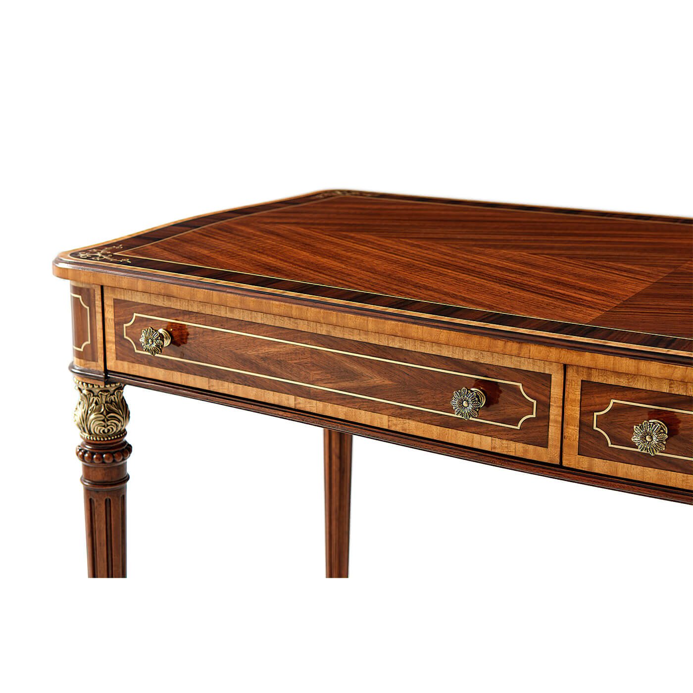 Close-up of Regency style desk corner, decorative drawer handles.