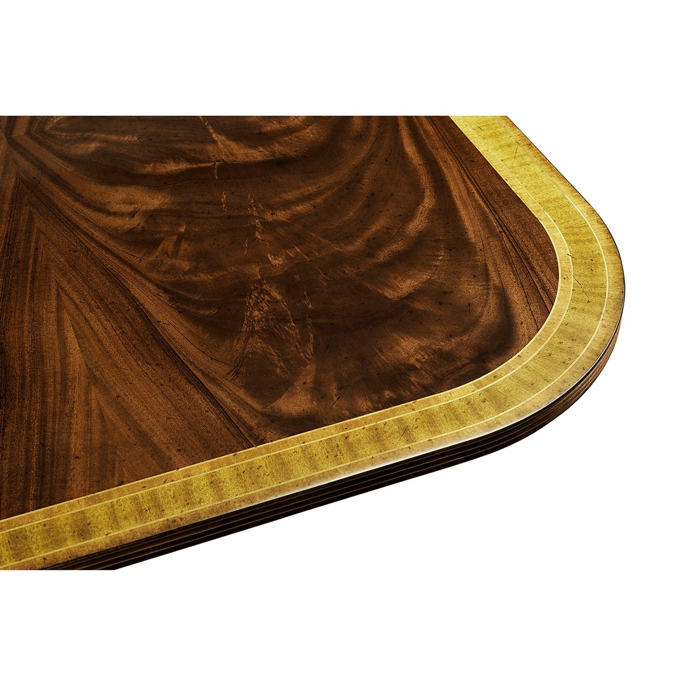 Regency dining table corner wood grain close-up.