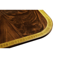 Regency dining table corner wood grain close-up.