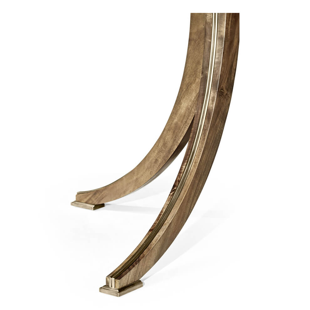 Close-up of curved leg on regency style dining table.