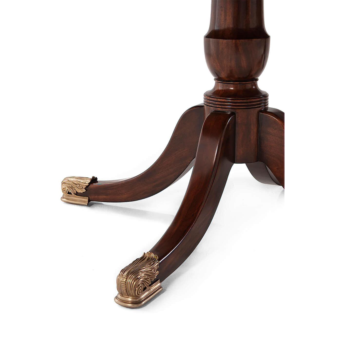 Close-up of mahogany table leg highlighting rich wood finish.