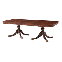 Mahogany dining table focused on detailed table legs.