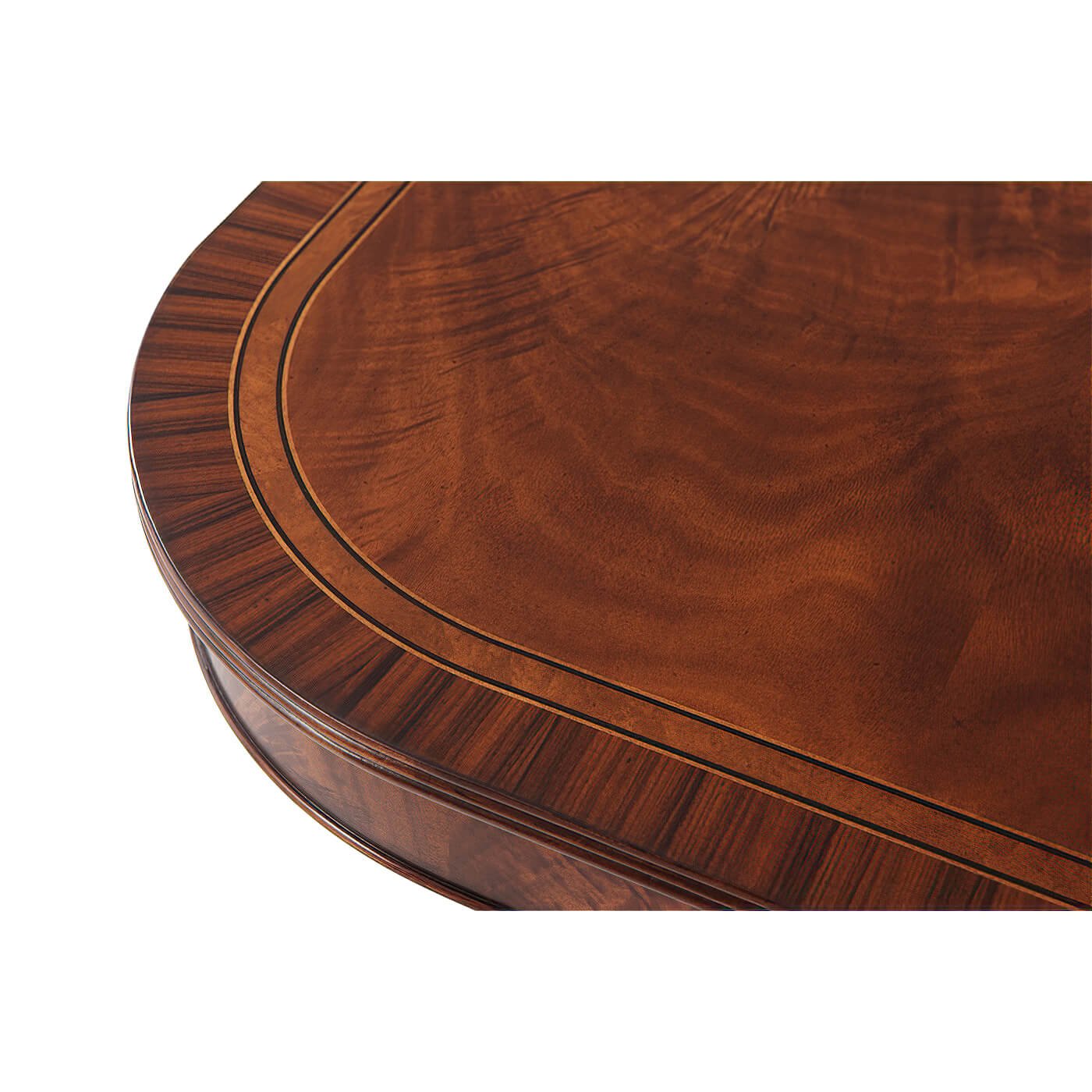 Detailed corner of mahogany table with inlaid wood pattern.