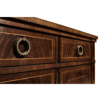 Close-up of drawer handles on mahogany sideboard.