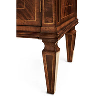 Close-up of mahogany sideboard leg design.