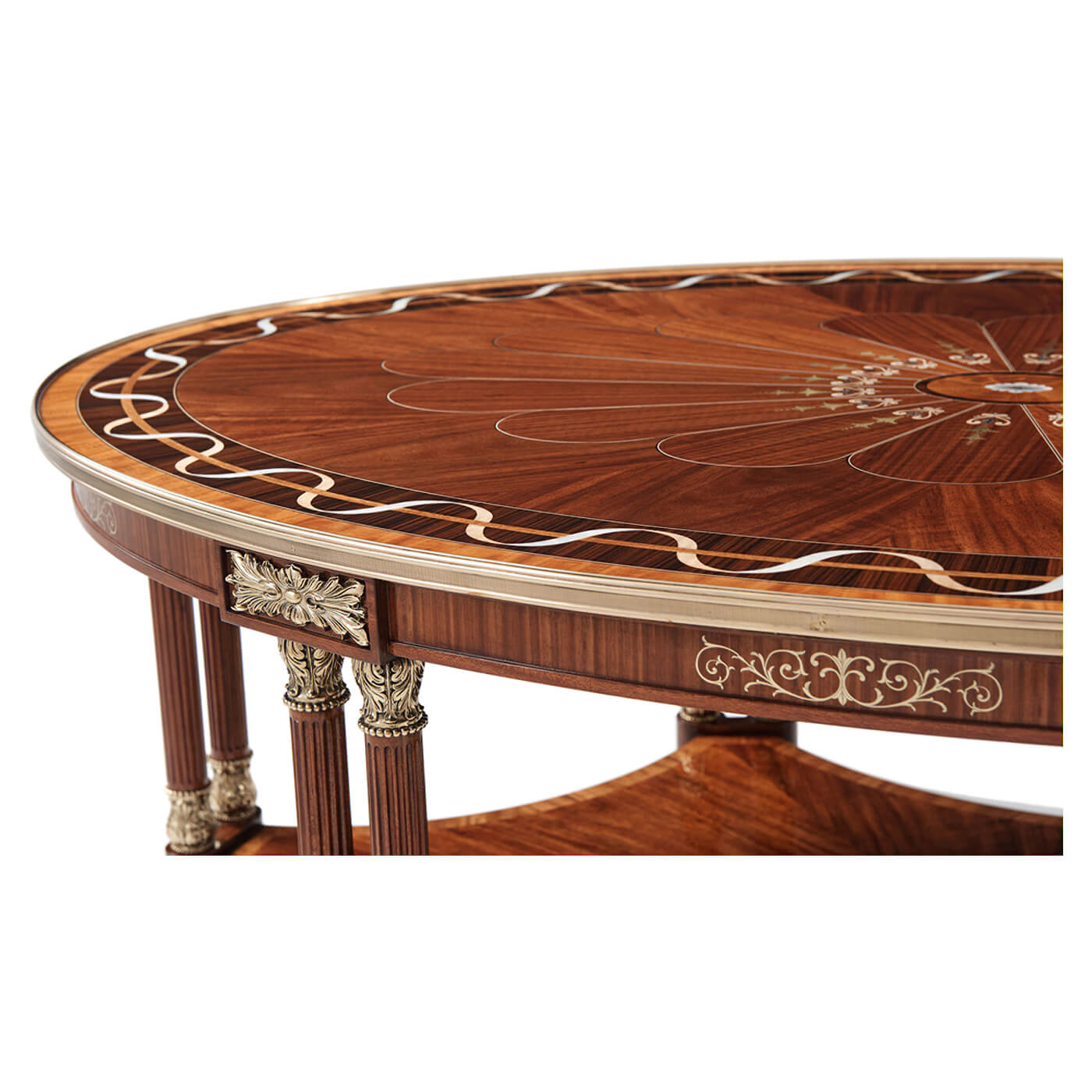 Close-up of oval coffee table edge and decorative inlays.