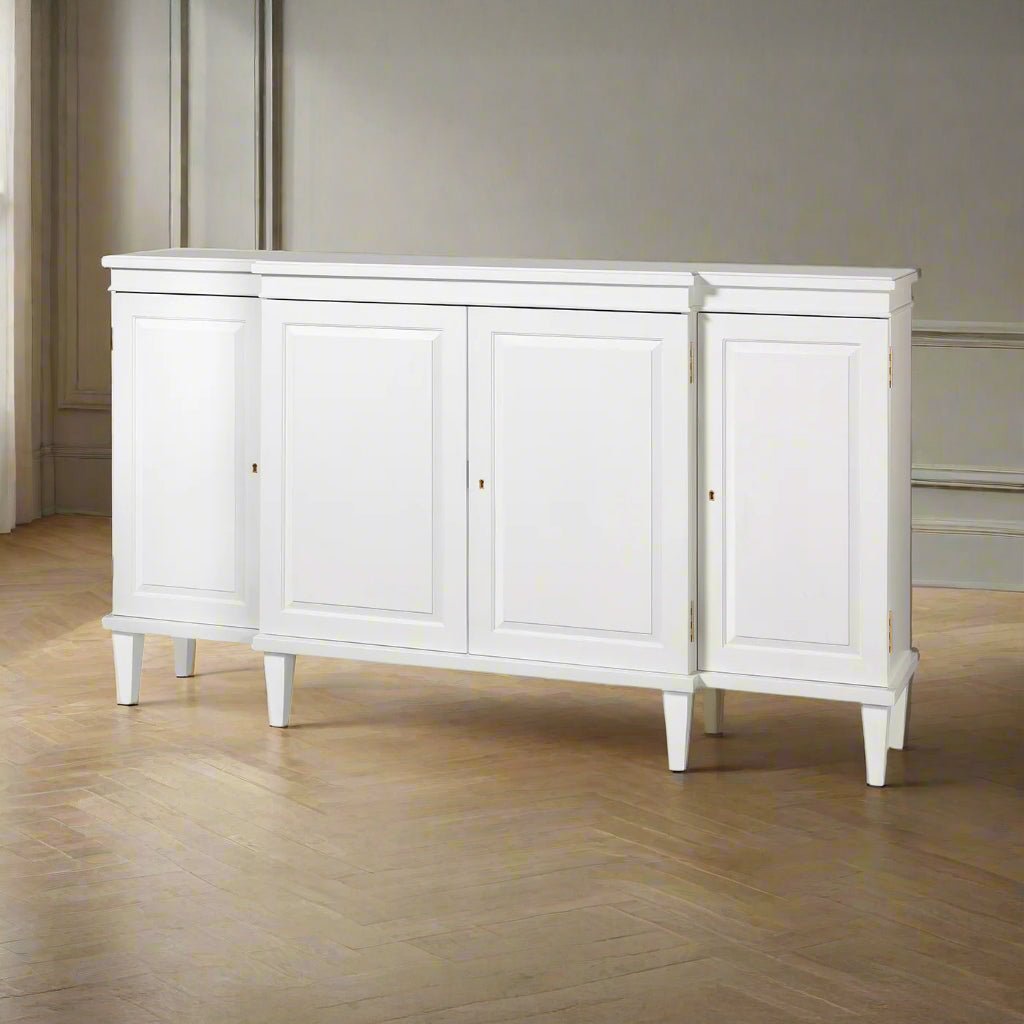 Regency style white credenza in a room, angled view.