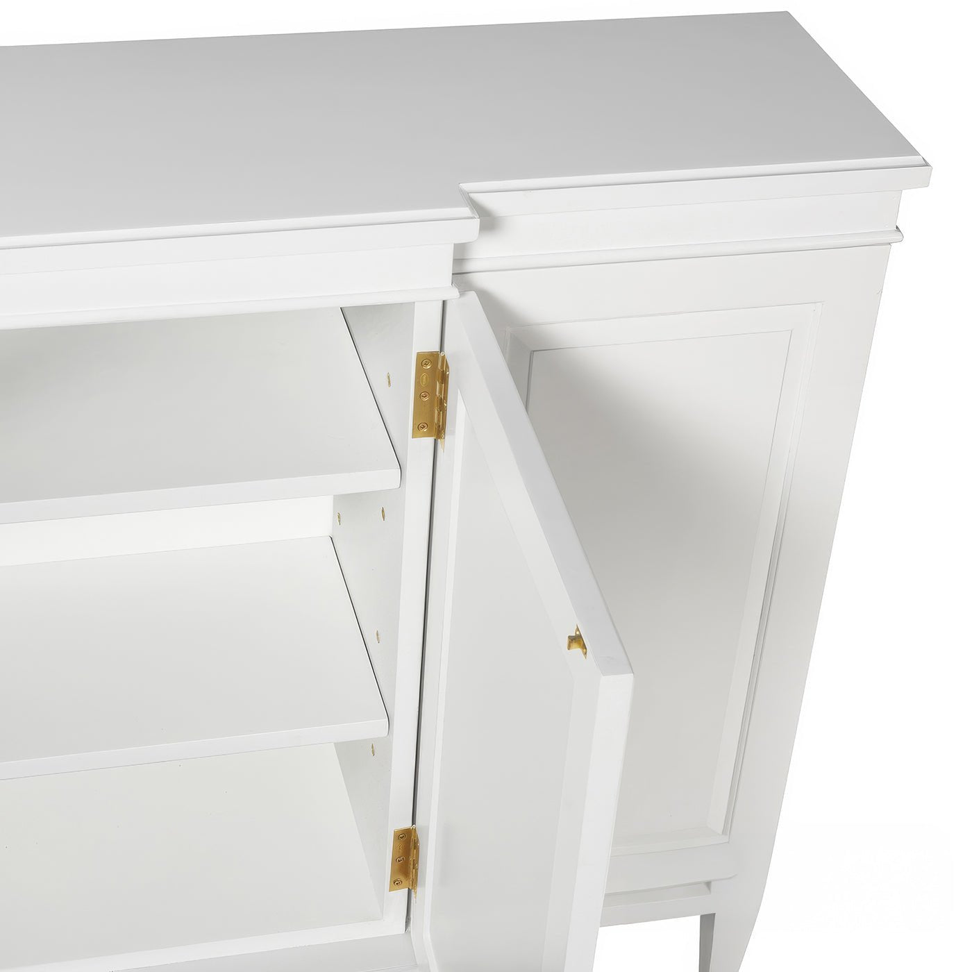 Interior shelves of Regency style credenza with door open.