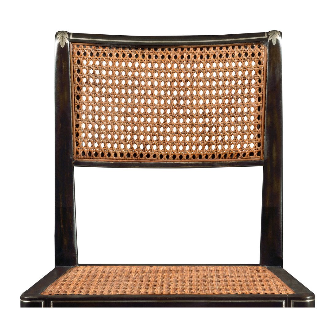 Close-up of Regency style chair's woven backrest and seat.