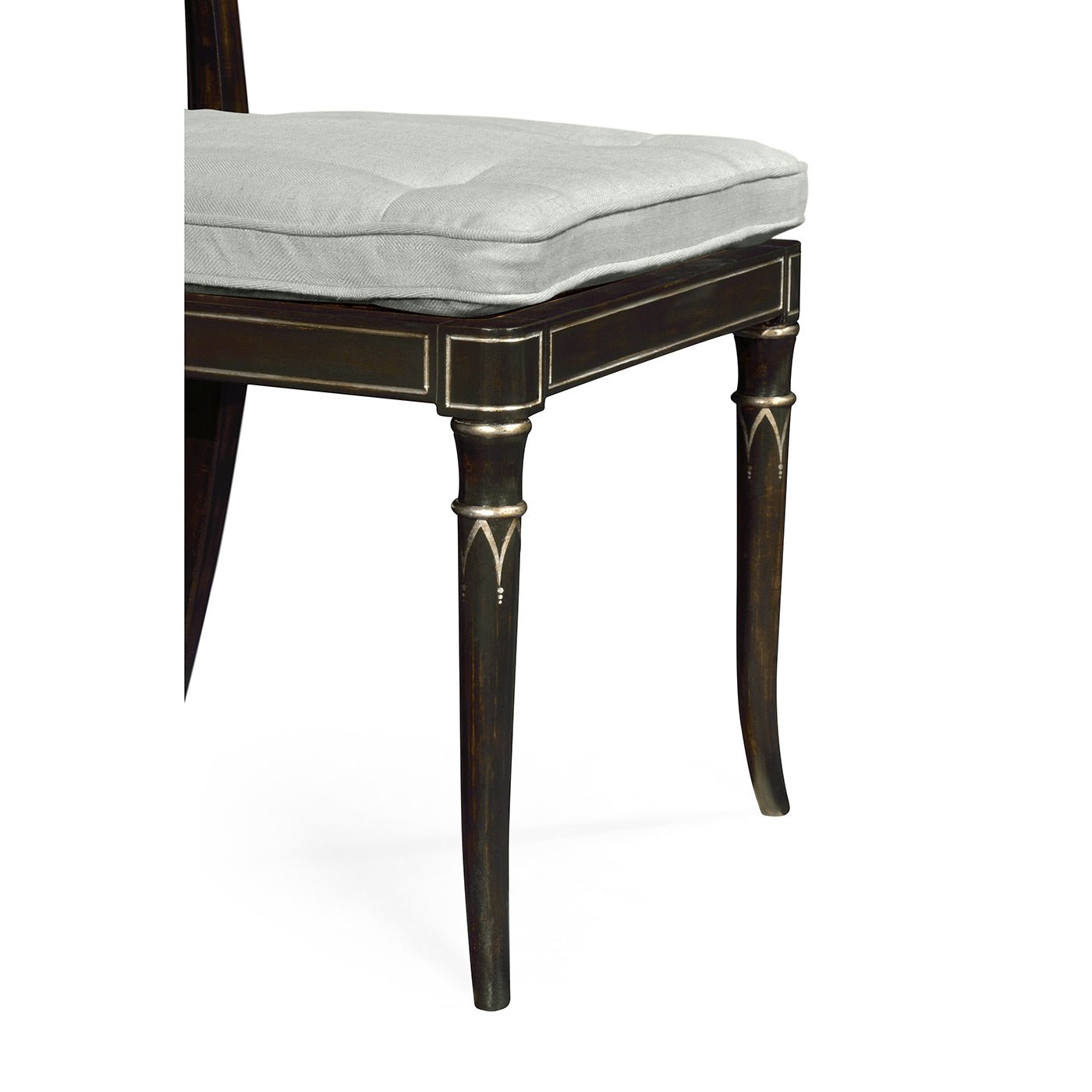Detailed view of Regency style chair leg design.