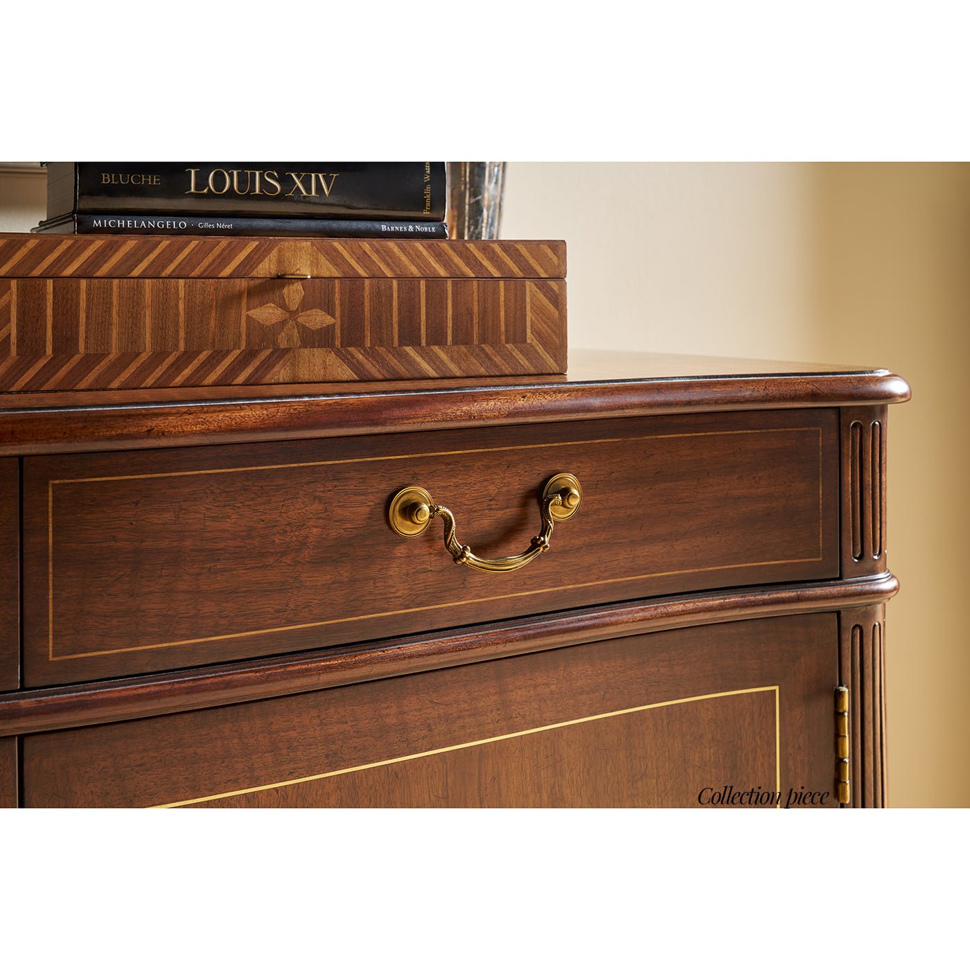 Close-up of drawer handle on Regency style sideboard buffet.
