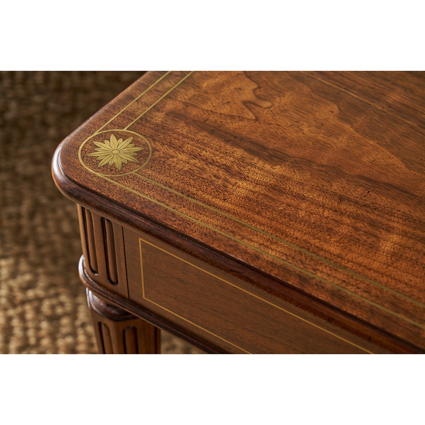 Close-up of table top, wood grain with corner design.