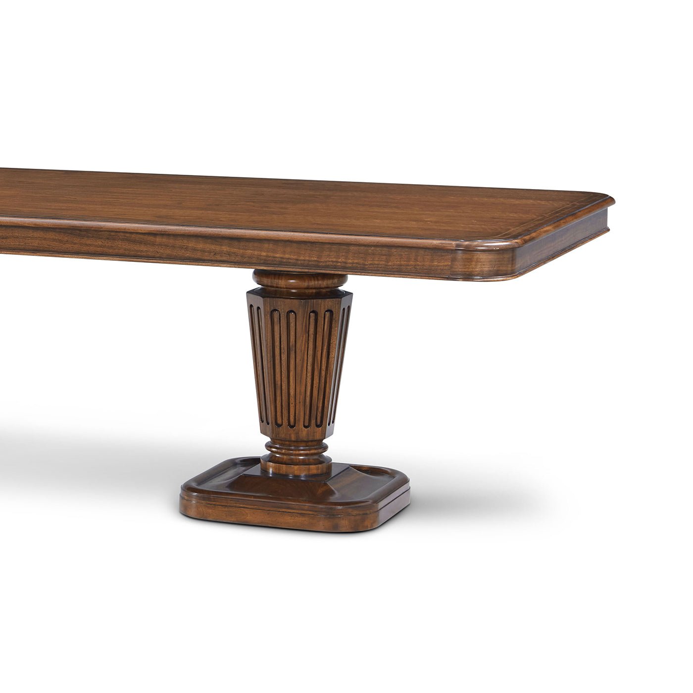 Close-up of table corner, walnut finish, pedestal detail.