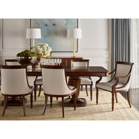 Dining room setting with walnut table and chairs, elegant decor.