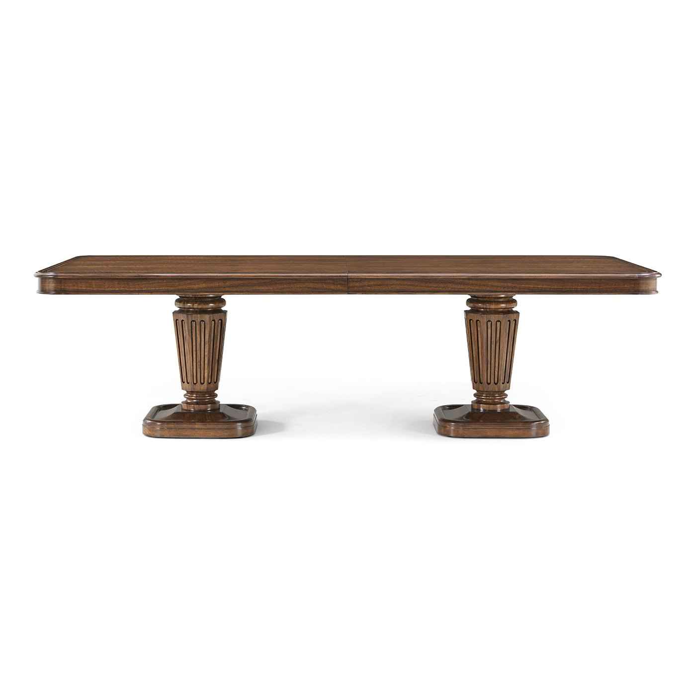 Straight view of walnut dining table, two pedestal bases.