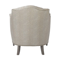Light upholstered tufted chair, back view with elegant curves.
