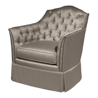 Upholstered tufted chair, angled view with detailed fabric.