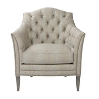 Light upholstered tufted chair, front view emphasizing tufted back.