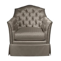 Upholstered tufted chair, front view highlighting cushion design.