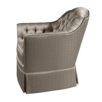 Upholstered tufted chair, side view showing armrest details.