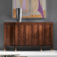 Walnut credenza in room with abstract painting and vase.