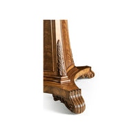 Detailed carving on base of walnut center table.