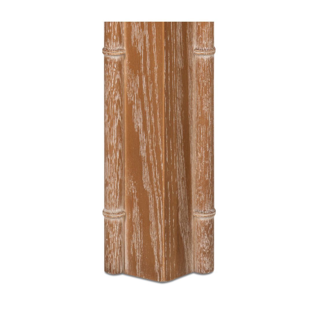 Close-up of table leg displaying wood grain.