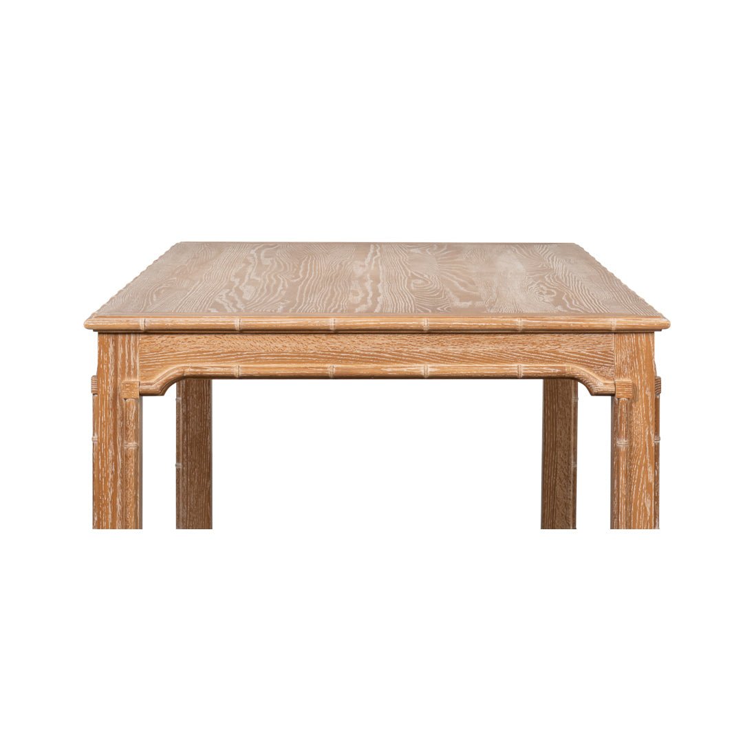 Close-up front of oak dining table edge.