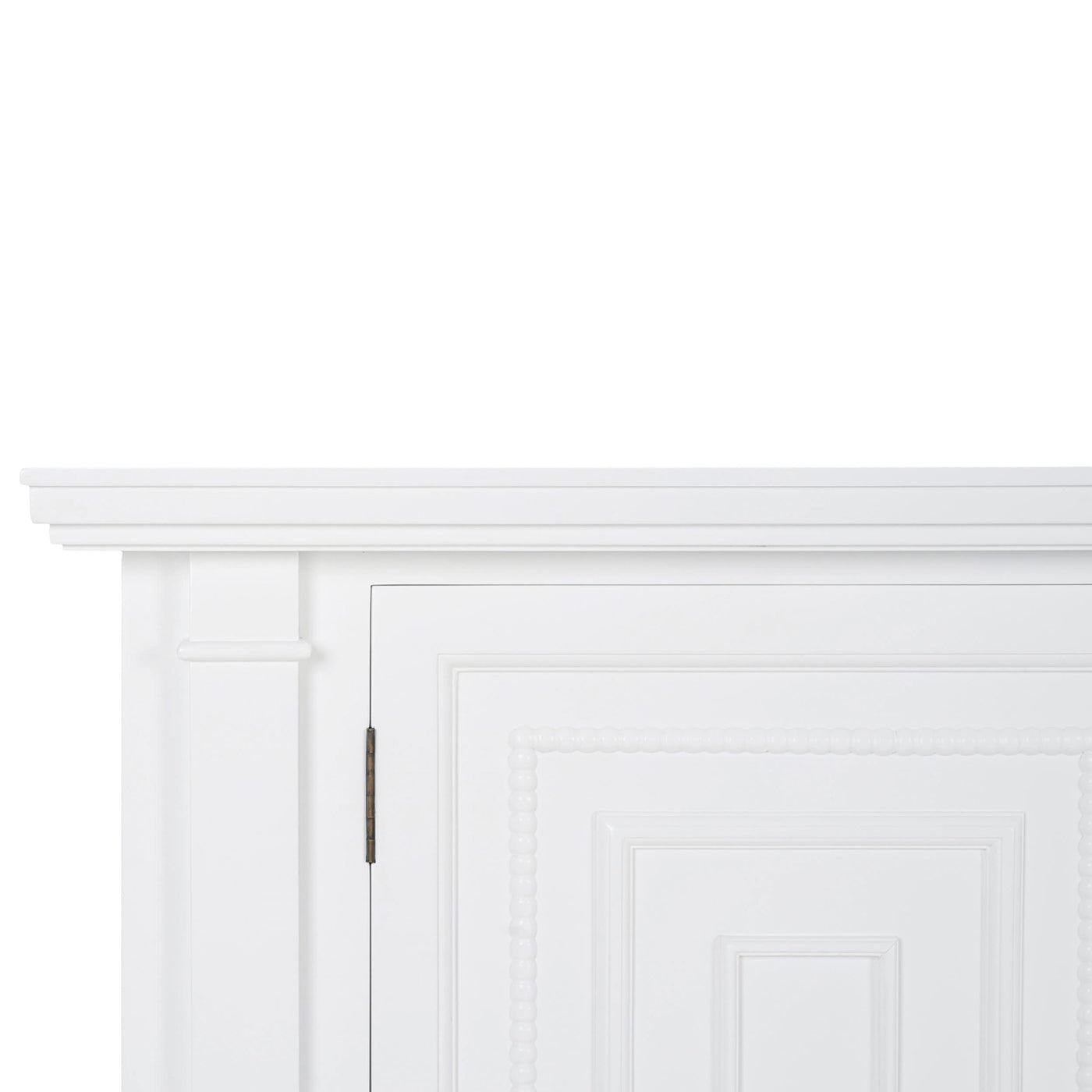 Close-up of white credenza detailing and hinges.