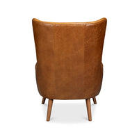 Back view of brown leather wingback chair, high back.