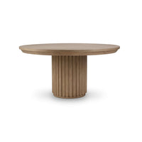 Round wooden dining table with ribbed column base.