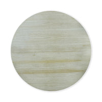 Top view of round fruitwood dining table surface.