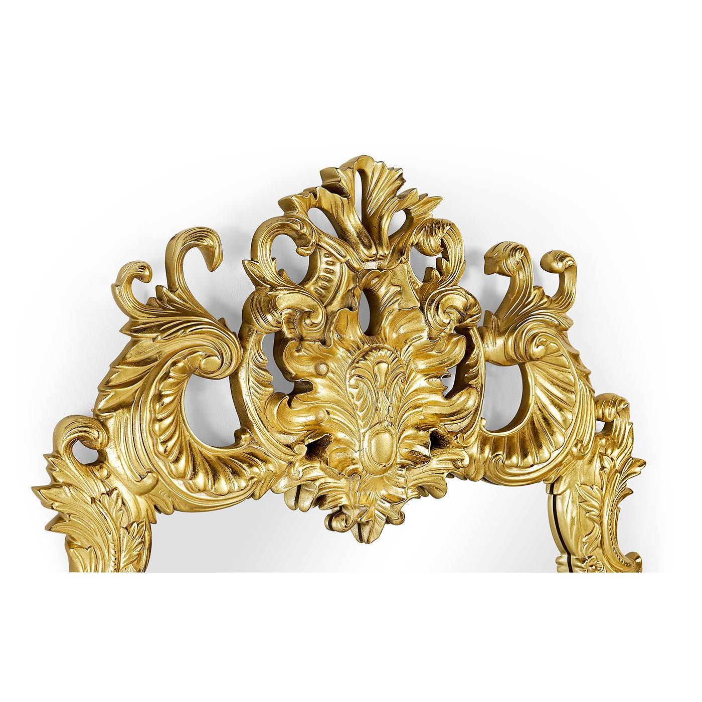 Close-up of Rococo giltwood mirror's intricate top design.
