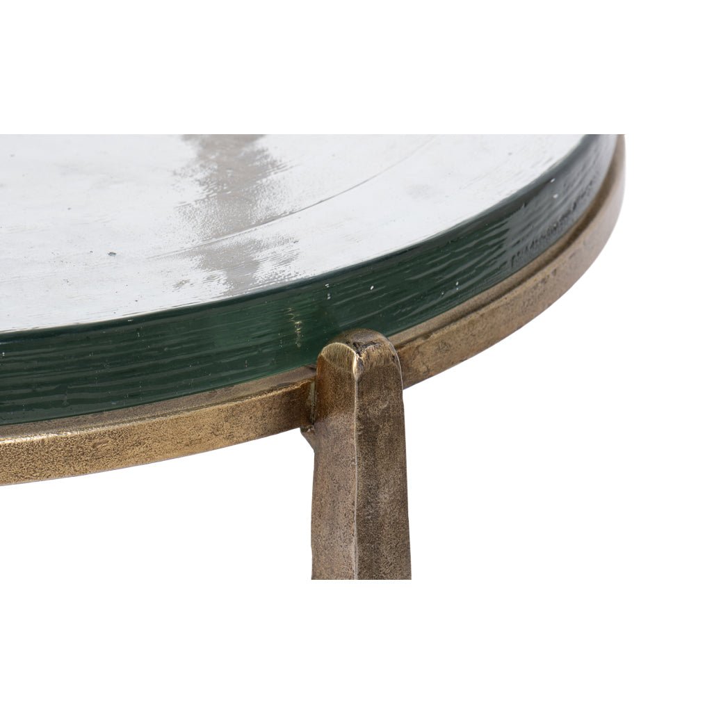 Detail of metal frame and glass edge on table.