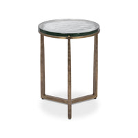 Round accent table showcasing three angled metal legs.