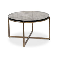 Round contemporary coffee table angled view with metal legs.