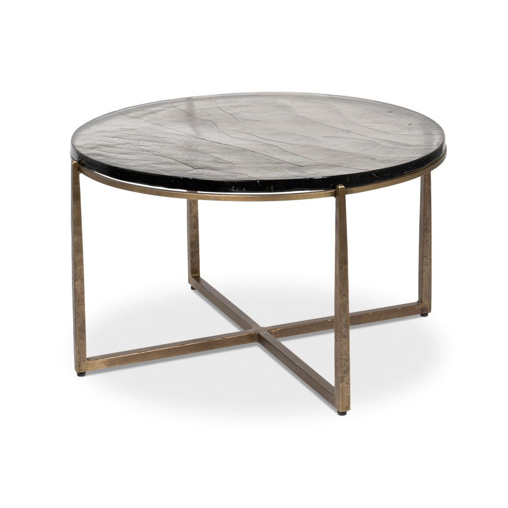 Round contemporary coffee table side view with cross base.