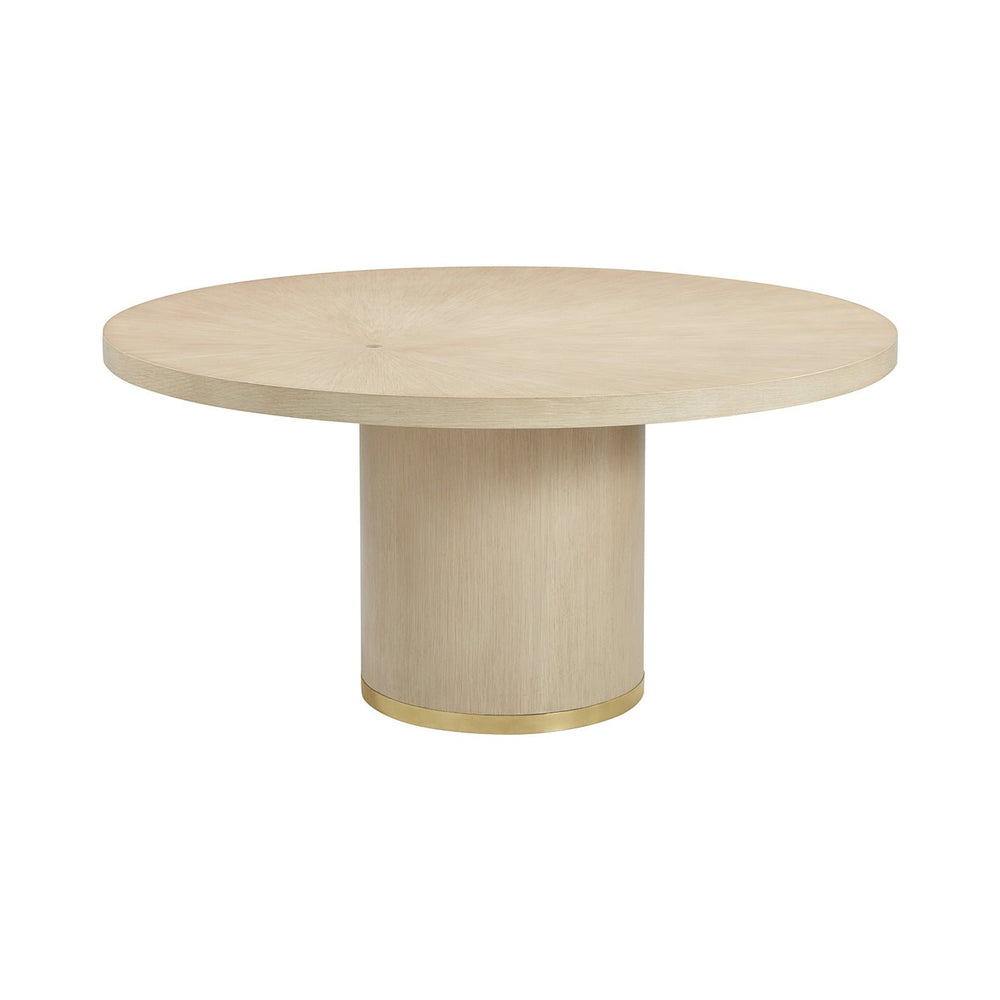 Light wood round dining table with cylindrical base.