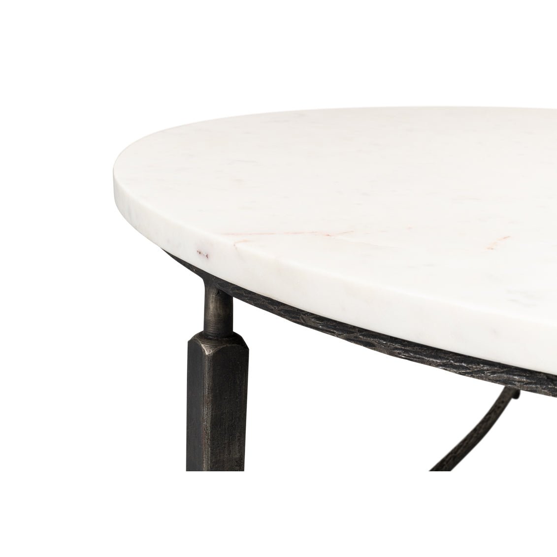 Edge detail of round marble coffee table.