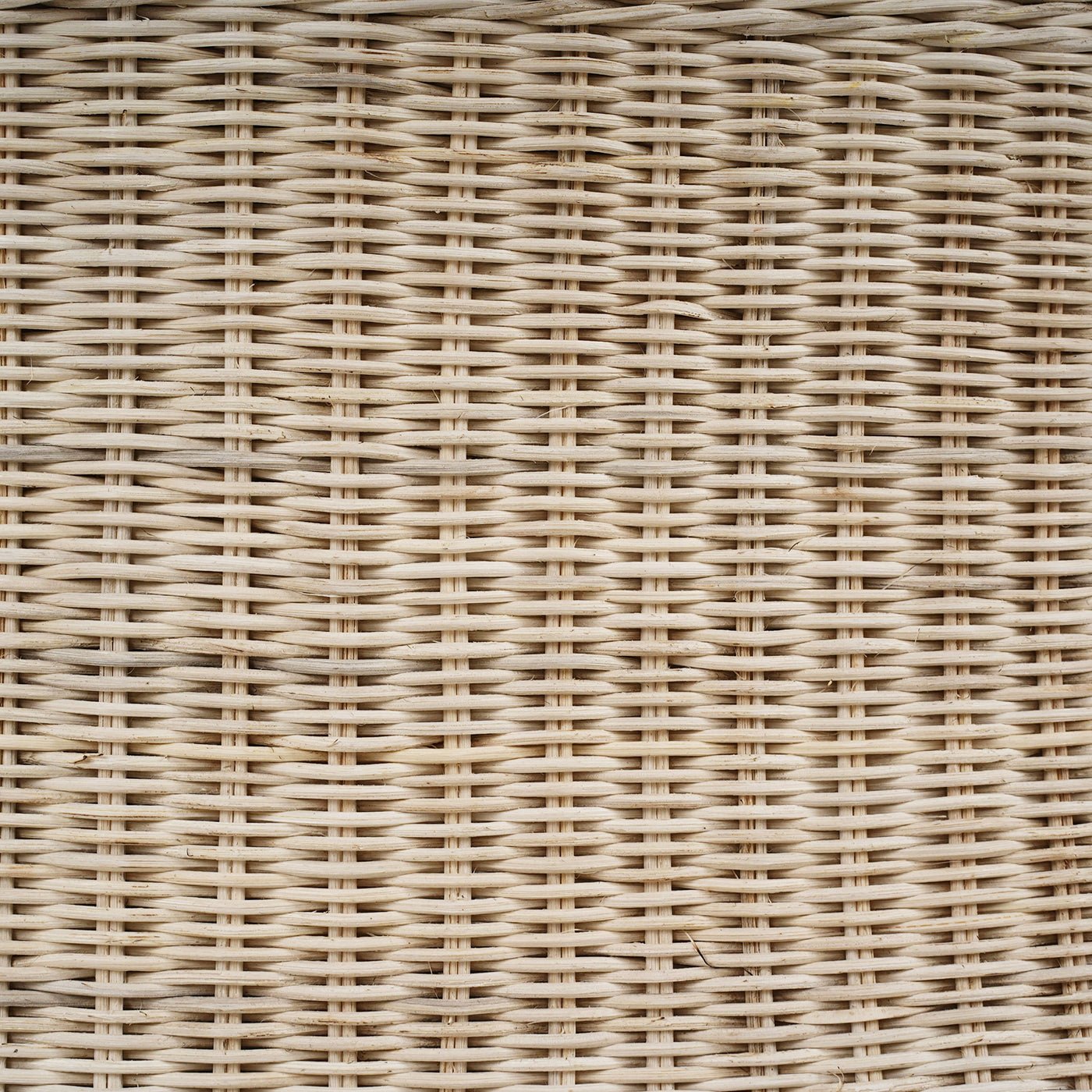 Detailed rattan weave on round coffee table.