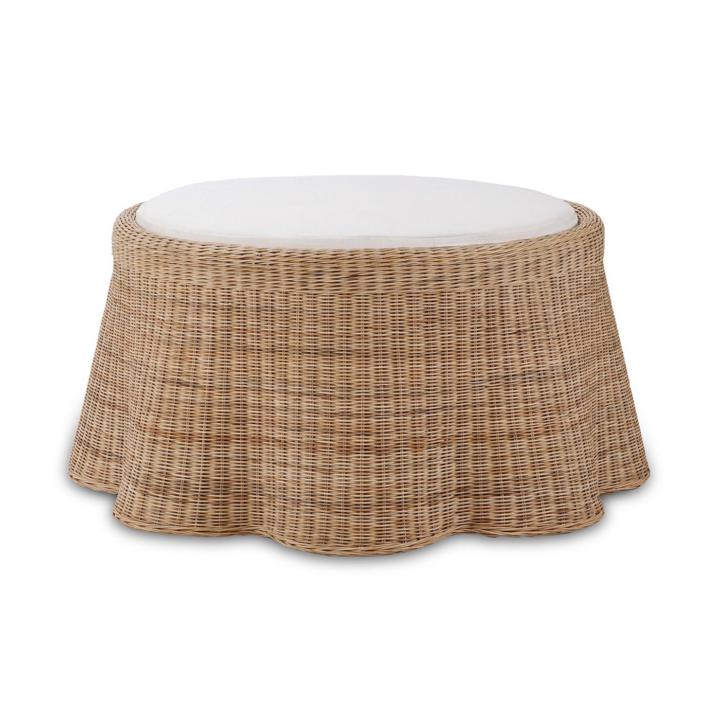 Round rattan ottoman front view with cushion.