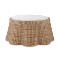Round rattan ottoman front view with cushion.