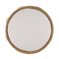 Top view of round rattan ottoman and cushion.