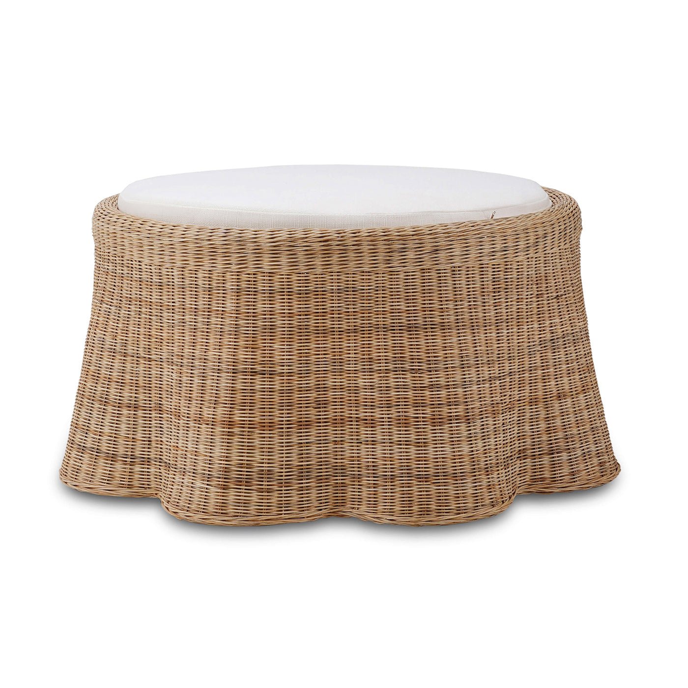 Side angle of round rattan ottoman with cushion.