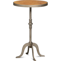 Round side table with a tobacco leaf top on a cast base with an aged iron patina