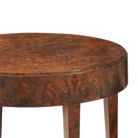 Close-up of round walnut burl table surface texture.