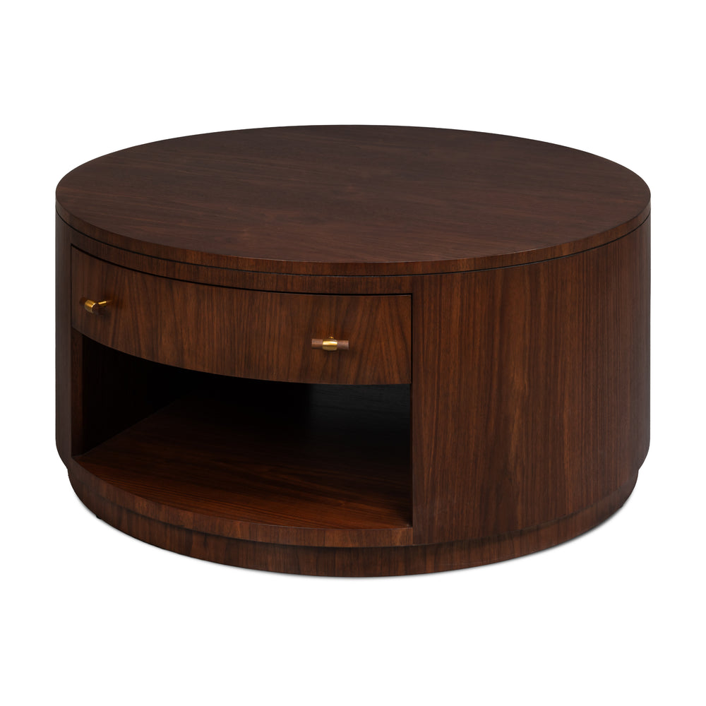 Round dark walnut drum coffee table with curved storage drawer and brass pulls
