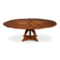 Partially extended walnut Jupe dining table, expanded segments.